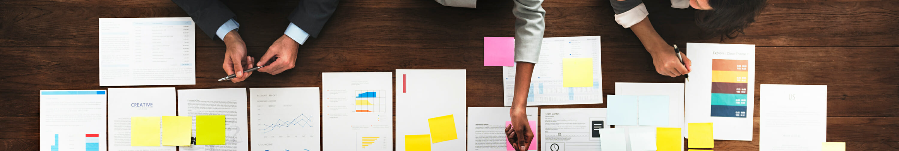 Papers and notes spread out on table